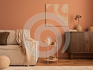 Warm and cozy composition of living room interior with mock up poster frame, wooden sideboard, modular beige sofa, brown pouf,
