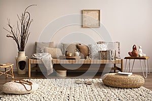 Warm and cozy composition of meditation living room interior with mock up poster frame, beige carpet, colorful pillow, coffee