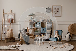 Warm and cozy kids room interior with mock up poster frame, beige wall with stucco, colorful sideboard, braided armchair, plush