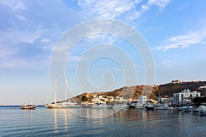 Warm dawn colors over the harbor of Patmos island, Dodecanese, Greece