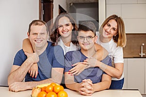 Warm Family Portrait in Sleek Kitchen Interior. Family time