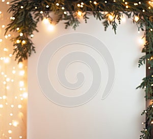 Warm Festive Lights on Lush Greenery Frame with Copy Space