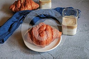 Warm Fresh Buttery Croissants with coffee for breakfast. French and American Croissants and Baked Pastries.