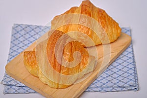 Warm Fresh Buttery Croissants and Rolls. French and American Croissants and Baked Pastries are enjoyed