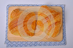 Warm Fresh Buttery Croissants and Rolls. French and American Croissants and Baked Pastries are enjoyed