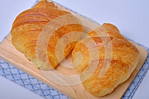 Warm Fresh Buttery Croissants and Rolls. French and American Croissants and Baked Pastries are enjoyed