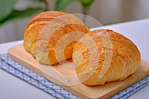 Warm Fresh Buttery Croissants and Rolls. French and American Croissants and Baked Pastries are enjoyed