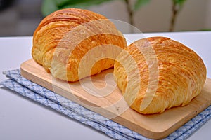 Warm Fresh Buttery Croissants and Rolls. French and American Croissants and Baked Pastries are enjoyed