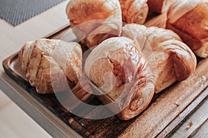 Warm Fresh Buttery Croissants and Rolls. French and American Croissants and Baked Pastries