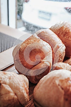 Warm Fresh Buttery Croissants and Rolls. French and American Croissants and Baked Pastries