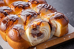 Warm, freshly cooked sweet bun rolls with indulgent chocolate filling