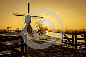 Warm and frozen windmill sunrise