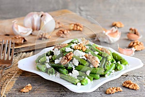 Warm green bean salad with cottage cheese and peeled walnuts. Diet green beans recipe. Vegetarian main dish. Rustic style