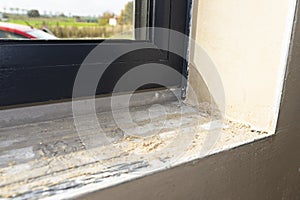 Warm installation of a three-layer window with a polystyrene window sill, view from the inside.