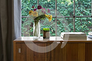 Warm interior looking onto a green hedge garden outlook