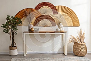 Minimalist console table with artistic decor and a statement fan wall piece in warm natural tones photo