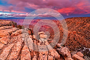 Warm light illuminates the Grand Canyon at sunset photo