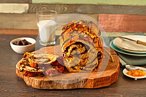 Warm loaf of chocolate and oranges braided bread photo