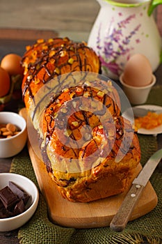 Warm loaf of chocolate and oranges braided bread photo