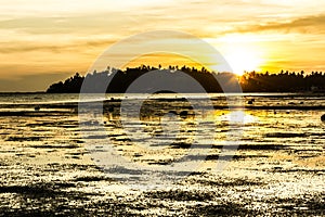 Warm, orange peaceful sunset landscape on the beach