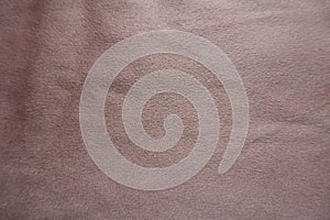 Warm pink artificial suede fabric from above