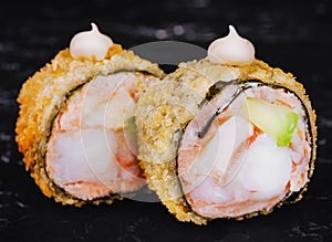 Warm rolls closeup on black stone