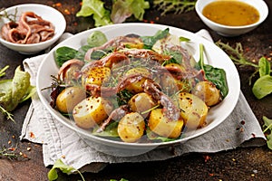 Warm salad with anchovy and baby potatoes and wholegrain mustard