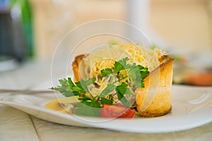 Warm salad with cheese in bread