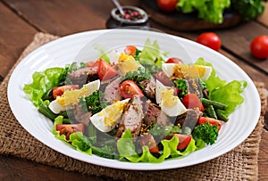 Warm salad with chicken liver, green beans, eggs, tomatoes and b