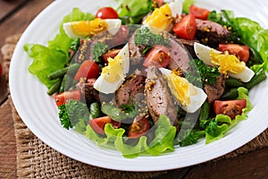 Warm salad with chicken liver, green beans, eggs, tomatoes