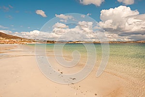 Warm sandy beach of Gurteen bay, county Galway, Ireland. Warm sunny day. Cloudy sky. Irish nature landscape