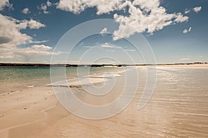 Warm sandy beach of Gurteen bay, county Galway, Ireland. Warm sunny day. Cloudy sky. Irish nature landscape