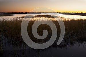 Warm sky over a marsh at Milford Point, Connecticut.