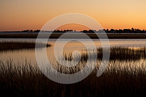 Warm sky over a marsh at Milford Point, Connecticut.