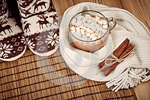 Warm slippers and cocoa with marshmallow.