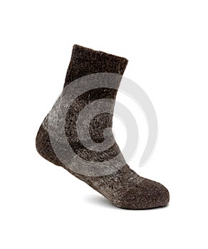 Warm sock made of natural sheep wool on a white background