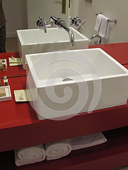Warm stylish bathroom handbasin with red
