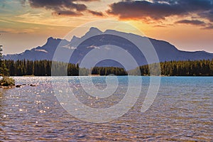Warm Sunrise Sky Over A Banff Mountain Lake