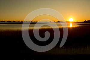 Warm sunset over the marsh at Milford Point, Connecticut.