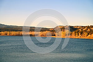 Warm Sunset View of a Lake and the Distant Shoreline