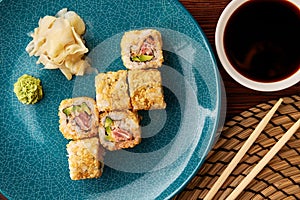 Warm sushi rolls with tuna and avocado