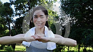 Warm up stretching healthy muscles portrait of a happy healthy asian woman.