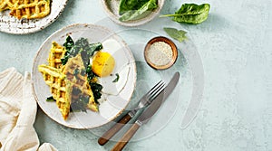 Warm waffles with spinach, cheese and fried egg.