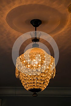 Warm white chandelier or lamp with ceiling in hall