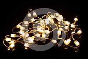Warm white led christmas holiday lights modules on black background