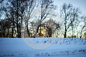 Warm winter landscape of sunset blue sky