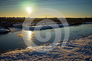 Warm winter landscape of sunset blue sky