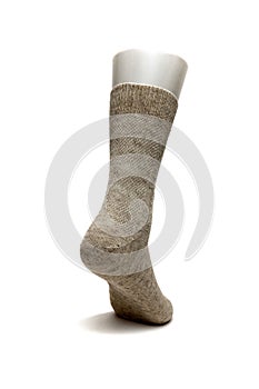 Warm women`s sock made of wool on a white background