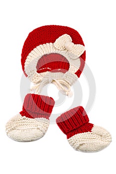 Warm woolen baby hat and booties over white