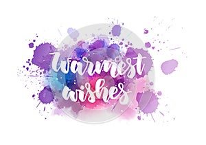 Warmest wishes holiday calligraphy on watercolor paint splash